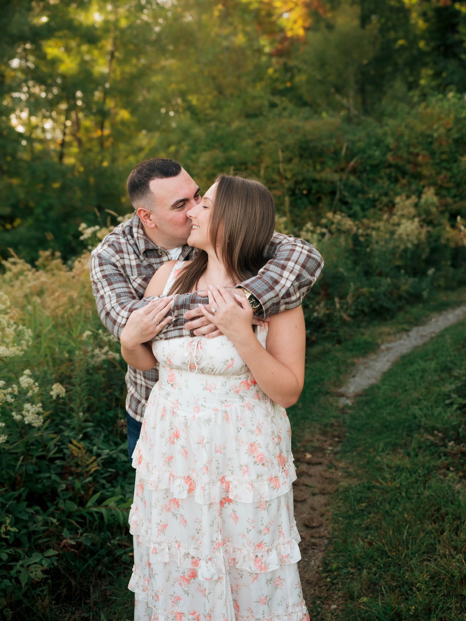 John embracing Erica during their engagement photo session